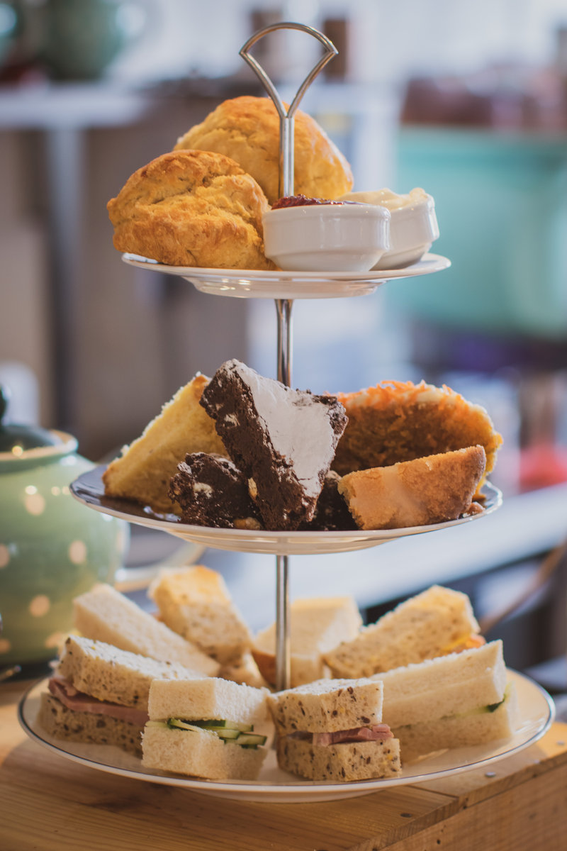 Tiered cake stand with freshly prepared Afternoon Tea from the Tea Room in Knutsford, sandwiches and cakes
