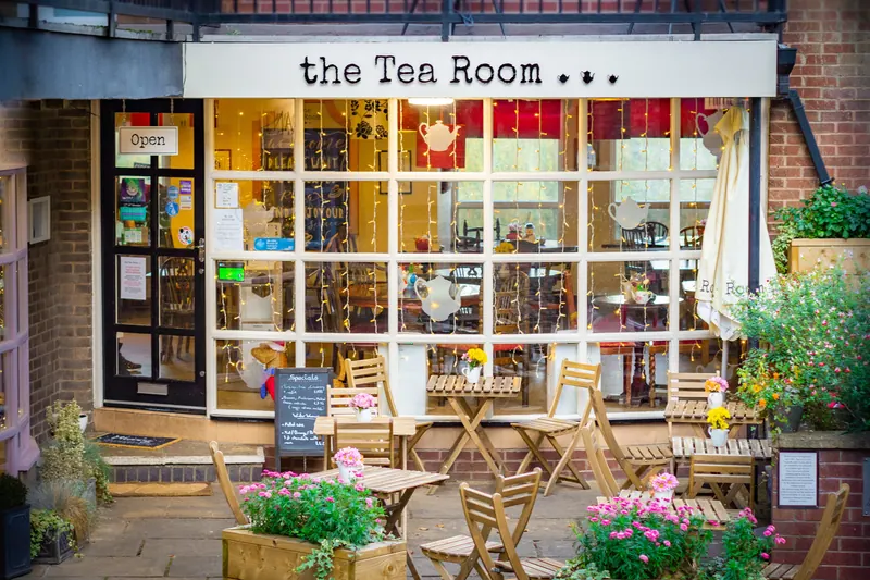 The Tea Room’s white shopfront and courtyard tables